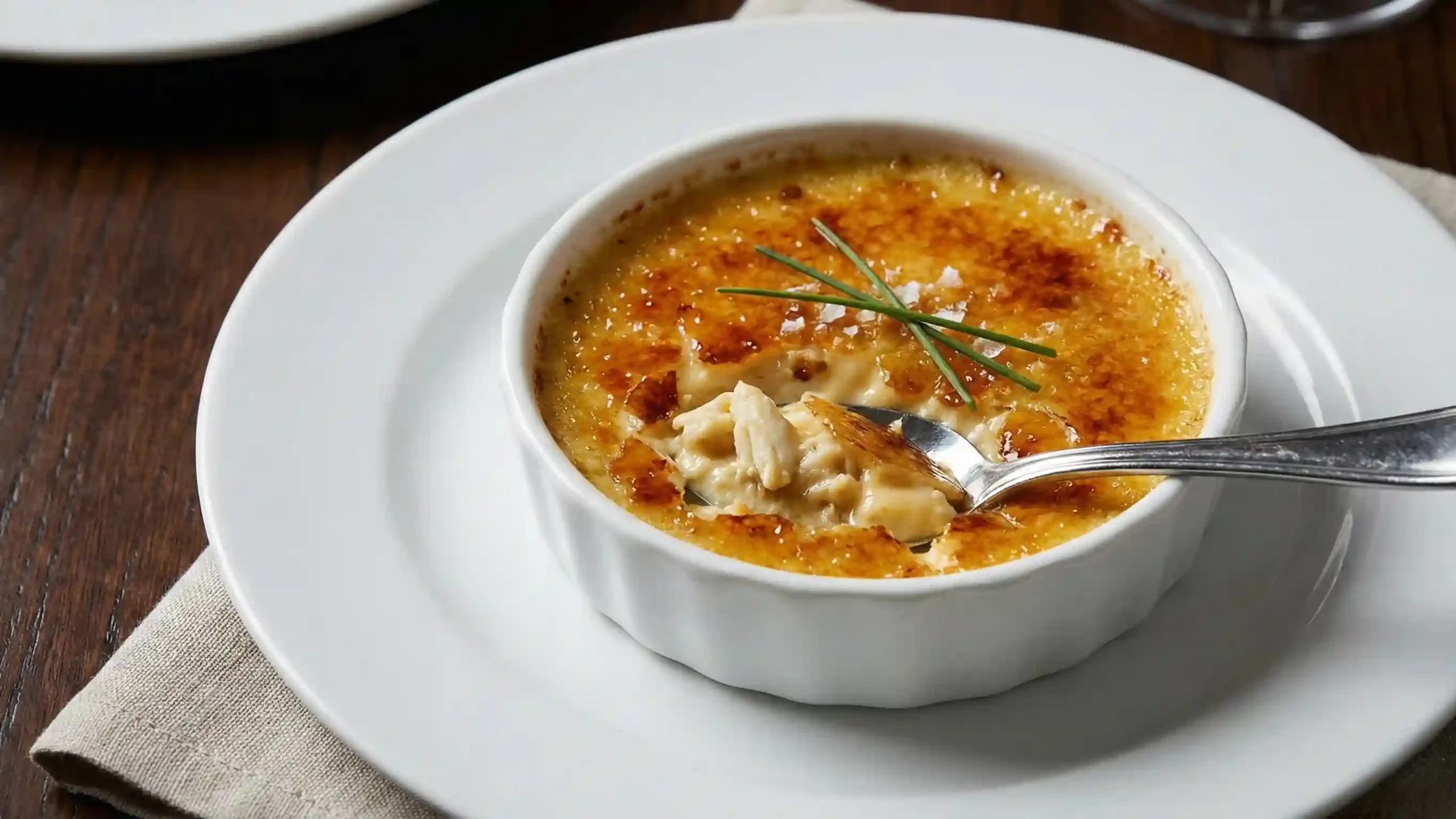 Restaurant-style crab brûlée with crisp caramelized sugar topping.