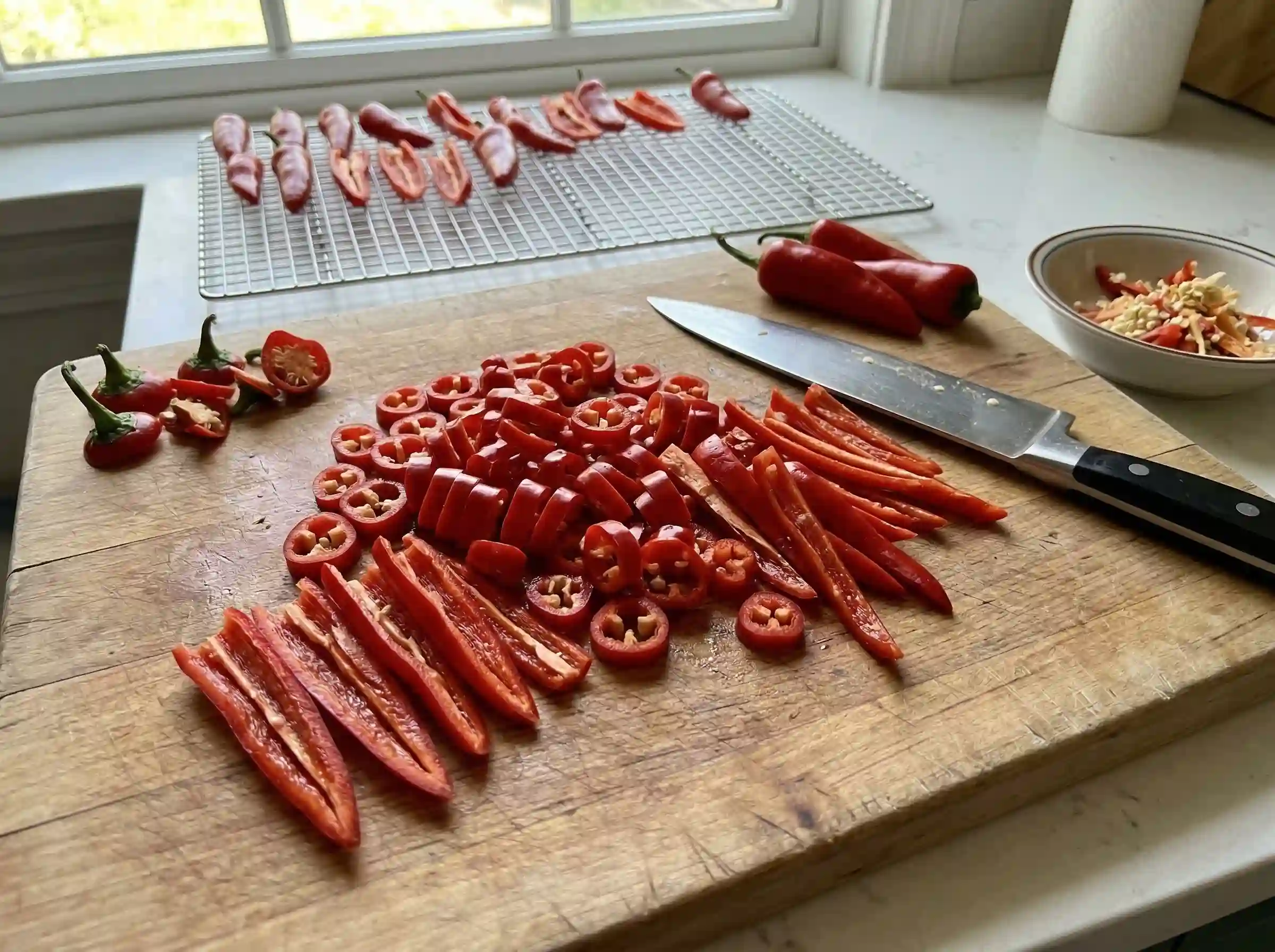 sliced Fresno peppers prepared for drying